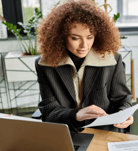 A city staffer updates a public portal with certified vital document translation so LEP residents can submit forms online.