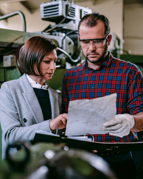 An engineer localizes HMI screens and manuals, using manufacturing translation services to match local market terms.