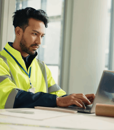 An engineer checks a safety manual draft, using Finnish translation services to keep technical warnings and steps clear.