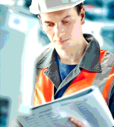 An engineer checks a bilingual user manual as Hebrew Translation Services handle technical terms, units, and warnings.