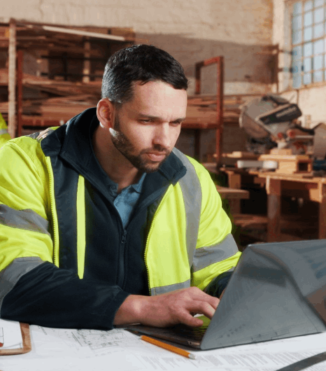An engineer marks up a user manual while Basque translation services refine technical terms and step-by-step instructions.