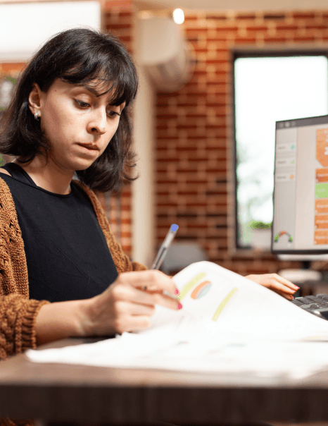 A linguist runs a QA checklist on charts for Market Research Translation Services, confirming document numbers match.