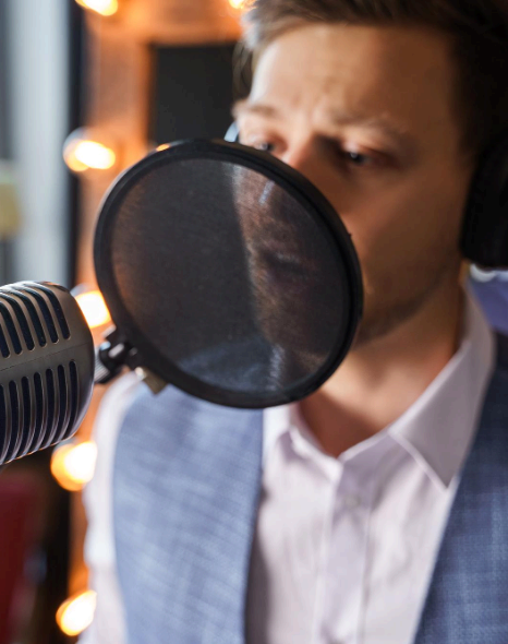 A producer compares business campaign reads and notes voice-match cues, using language voice over services for continuity.