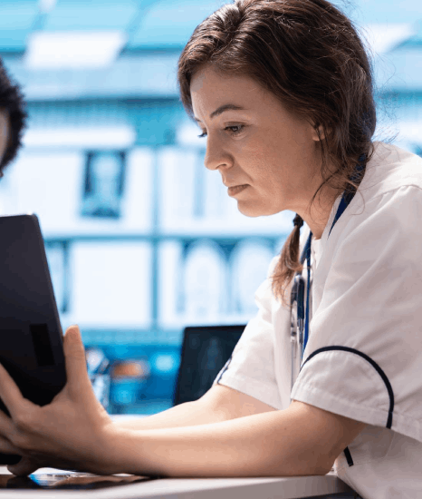 A nurse reviews translated patient instructions created with healthcare translation services to confirm clear medical.