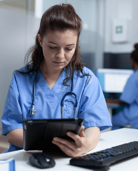 Healthcare professional reading translated manual from safety-focused medical device translation services. Healthcare professional reading translated manual from safety-focused medical device translation services.