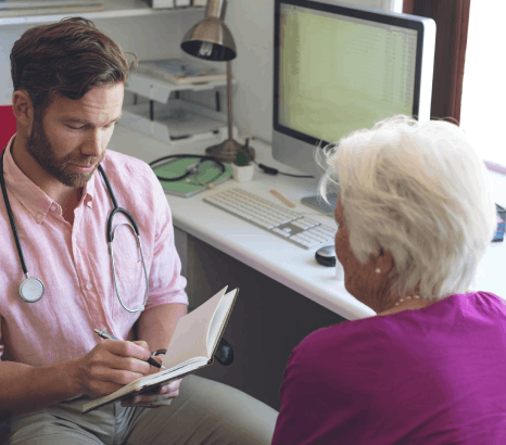 A medical linguist edits hospital reports using healthcare translation services, cross-checking diagnoses, labs, and terms.