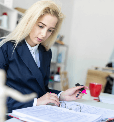 A reviewer checks a medical record translation, using Finnish translation services to confirm dosage terms and notes.