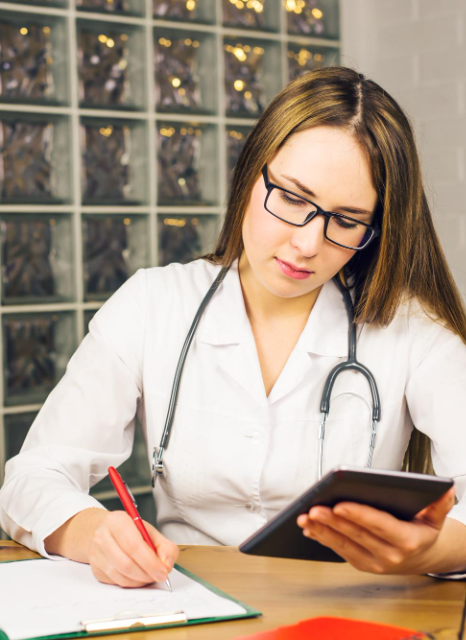 A coordinator reviews bilingual consent forms for medical records translation in New York during a hospital study intake.