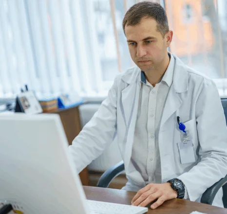 Doctor using medical translation to ensure accurate translation of patient records and prescriptions in Midtown Manhattan.