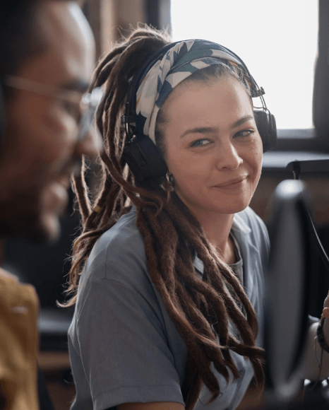 Visitors use headsets playing a voice over service for museum tour, creating memorable visitor experiences on site.