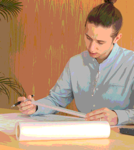 A project manager reviews multilingual briefs and timelines while coordinating Hebrew Translation Services for varied client.