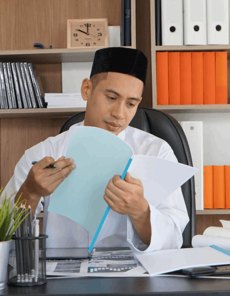 A linguist compares language files, using Indonesian translation services alongside other languages for a global content.