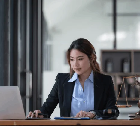 Lawyer using multilingual Legal translations to ensure compliance with different legal systems across global jurisdictions.