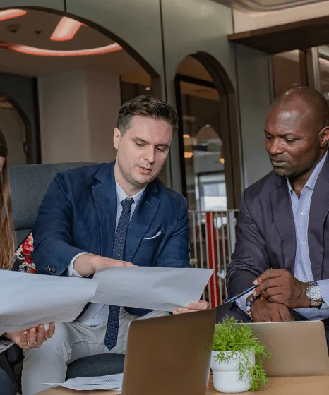 A team compares multilingual product listings as urgent translation services speed international business expansion.