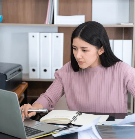 A restaurant owner reviews multilingual menu pages as overnight translation services keep dish names clear for visitors.