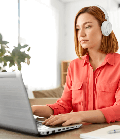 A captioner uses post production captioning services to QA multilingual captions, checking timing on a playback monitor.