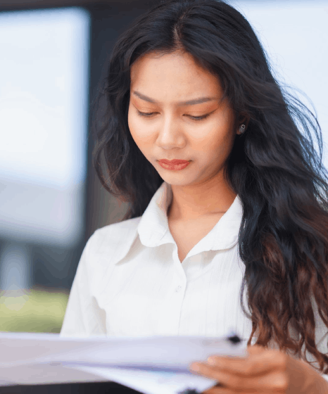 A web editor reviews multilingual site pages while Thai translation services keep headings and product terms consistent.