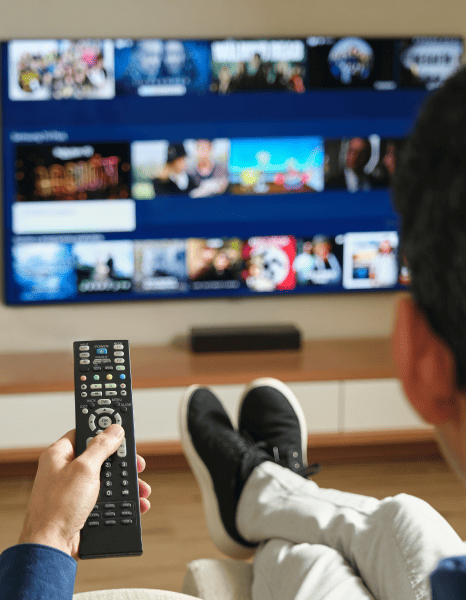 Customer watching Netflix content with multilingual captions to access global content. Customer watching Netflix content with multilingual captions to access global content.