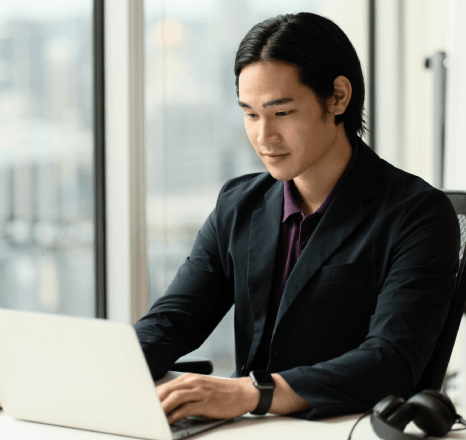 A marketer reviews Korean SEO keywords on a laptop, using korean translation services new york for marketing content.