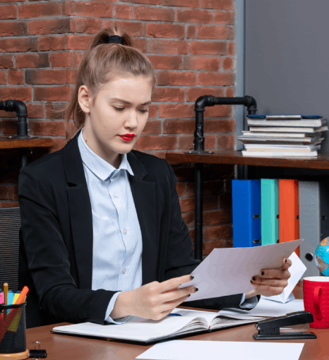 An accountant compares a translated financial statement with russian translation services new york to brief stakeholders.