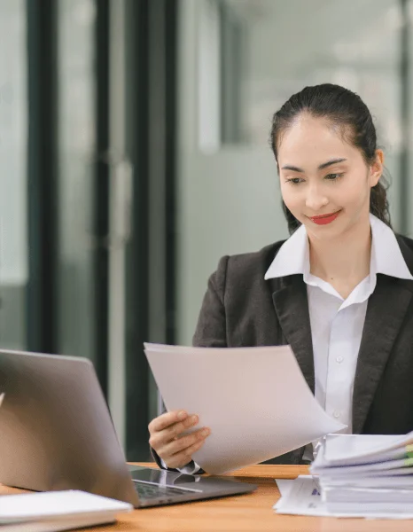 A professional translator works under a desk lamp as urgent translation services meet a secure, rapid deadline.