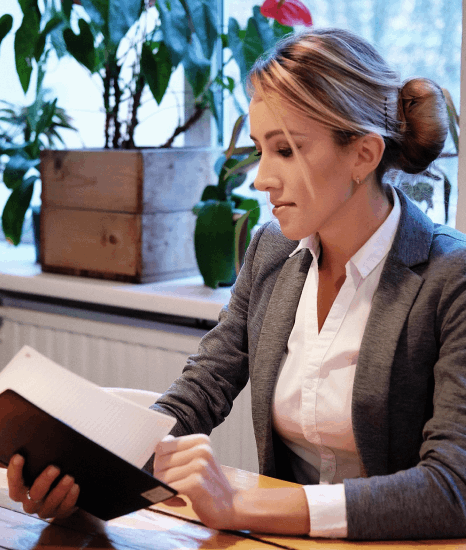 A linguist compares a video script, brochure PDF, and webpage, using online french translation services for each type.