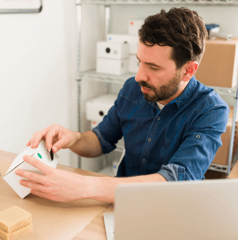 A specialist checks dieline packaging text after farsi typesetting services, confirming RTL flow and legible labels.
