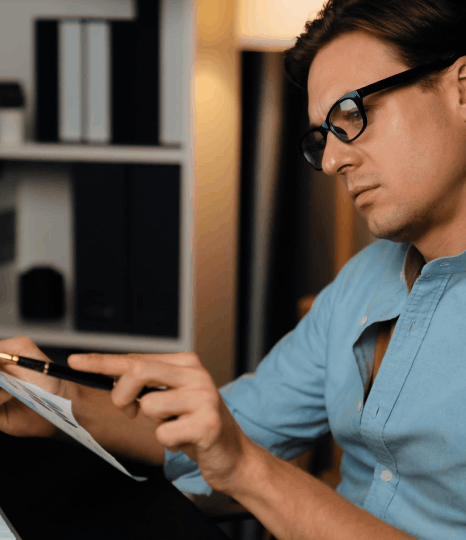 A project manager reviews technical documents as iot translation services apply $0.10 per word pricing for manuals.