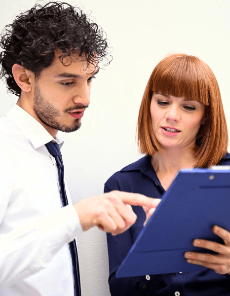 A buyer compares bilingual purchase orders, using manufacturing translation services to confirm procurement quantities.