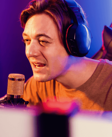 A studio actor records character lines in a booth, delivering professional specialized video game voice over services.