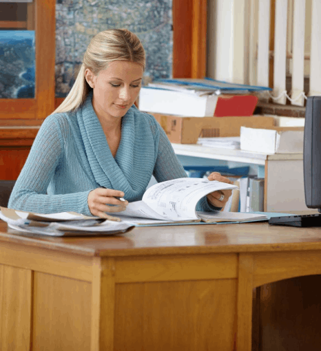 A reviewer marks edits on a bilingual draft, ensuring professional Hungarian translation services deliver accurate results.