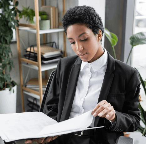 A project coordinator checks a deadline timer while ordering professional Afar translation services with same-day delivery.
