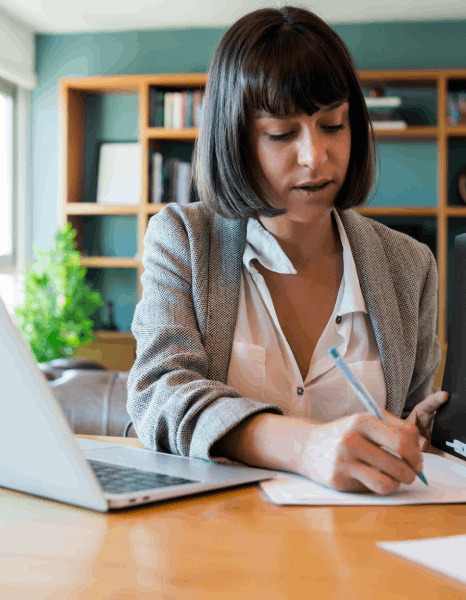 A proofreader compares two document versions to catch errors, supporting Hungarian translation services for official records.