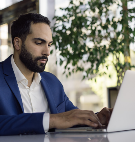 An HR manager proofreads an employee handbook as Punjabi Translation Services prepare clear, industry-ready onboarding text.