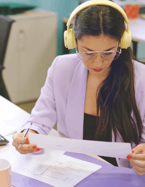 A QA reviewer compares source and target pages as pdf translation services deliver error-free language conversion.