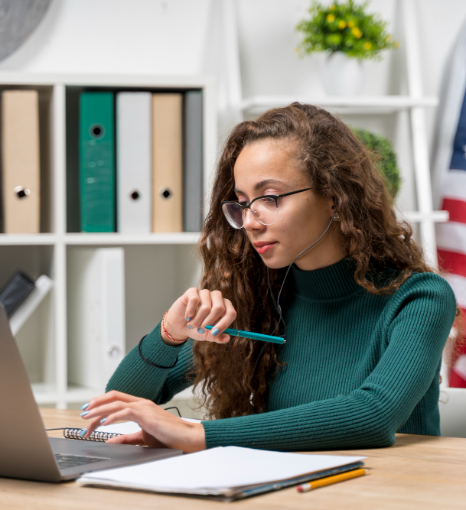 A reviewer checks date formats and stamp placement as Punjabi Translation Services proofread immigration documents.