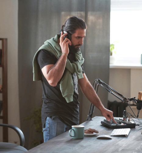 A QA specialist listens for noise and clicks on studio monitors, using language voice over services with technical QC.