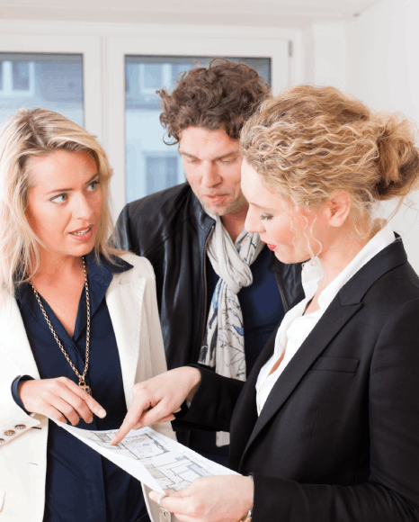 A landlord and tenant compare the original contract to a lease agreement translation before signing a real estate lease.