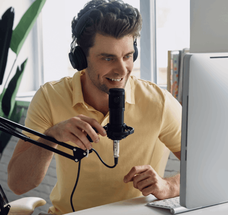 A voice artist records IVR prompts in a studio as Telephone Voiceover Services guide callers through business phone systems.