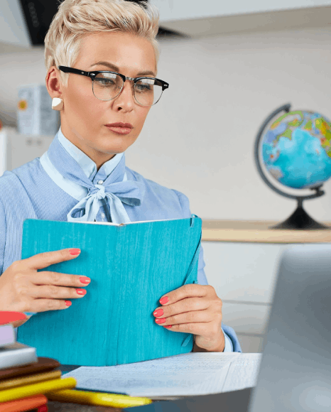 A translator cross-checks names and dates on USCIS forms while preparing official Latvian translation services for records.