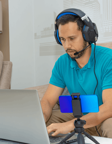 A narrator records E-learning Voiceover Services for a remote lecture, reading a script for an asynchronous course.