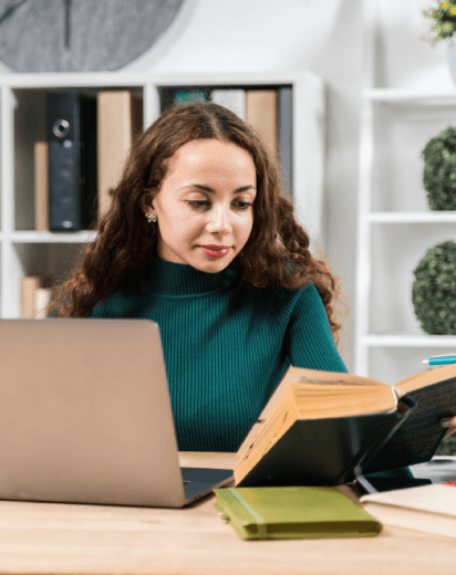 A researcher compares scanned archives to a translated draft as Biography Translation Services keep historical details clear.