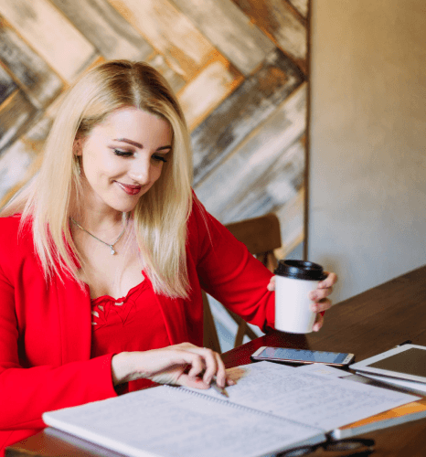 A linguist compares Danish and English paragraphs to keep tone consistent, showing Danish translation services for accuracy.