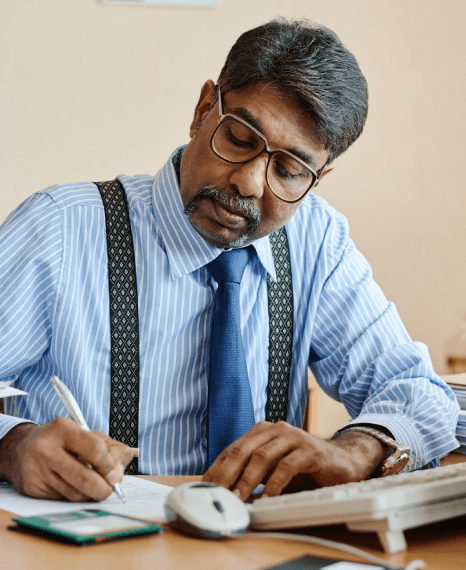 A sales director updates a pitch deck as Marathi translation services standardize corporate messaging for new markets.
