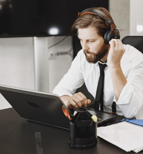 A project manager replies by SMS to check progress, using same day transcription services with real-time status updates.