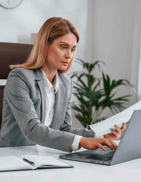 A typist enters handwritten notes from scanned pages as Manuscript Typing Services deliver clear digital conversion files.
