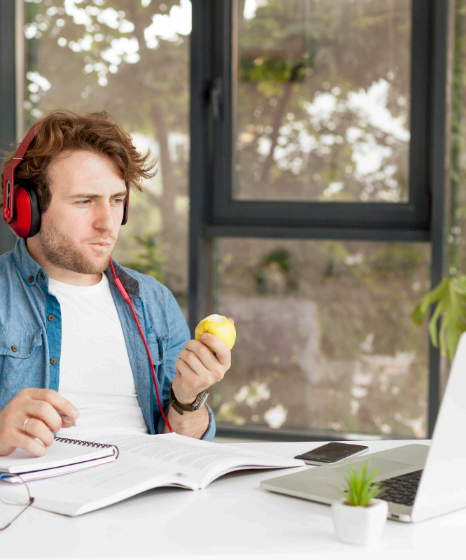 A course producer proofreads an e-learning script for German Voice Over Services, marking pauses and key terms.