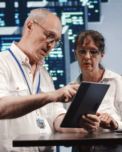 Two technicians verifies secure backups and audit logs so Military Translation Services keep defense translations protected.