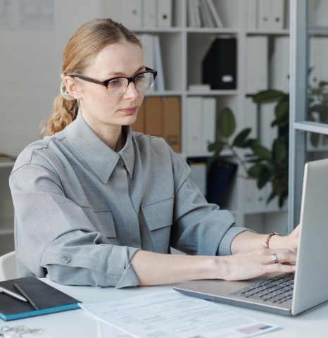 A translator uploads scans to a secure portal while Dari Translation Services prepare immigration documents for USCIS filing.
