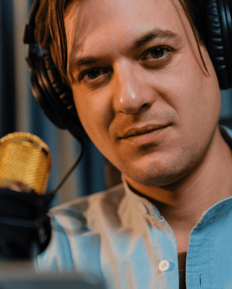 A trailer editor marks dramatic beats as Deep Voiceover Services capture deep male trailer narration in the booth.